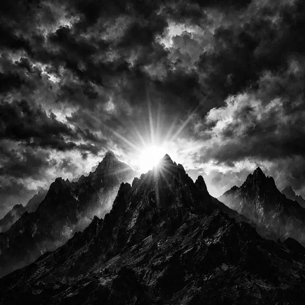 A high-contrast black and white sunrise representing rational decision-making and why emotions ruin your decisions.